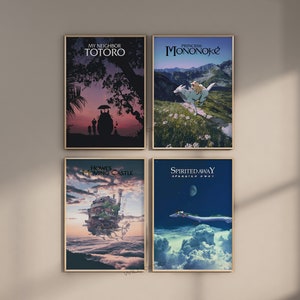 May include: Four framed art prints featuring animated movie posters. The posters include "My Neighbor Totoro," "Princess Mononoke," "Howl's Moving Castle," and "Spirited Away." Each poster has a unique color palette and design, with text at the top.