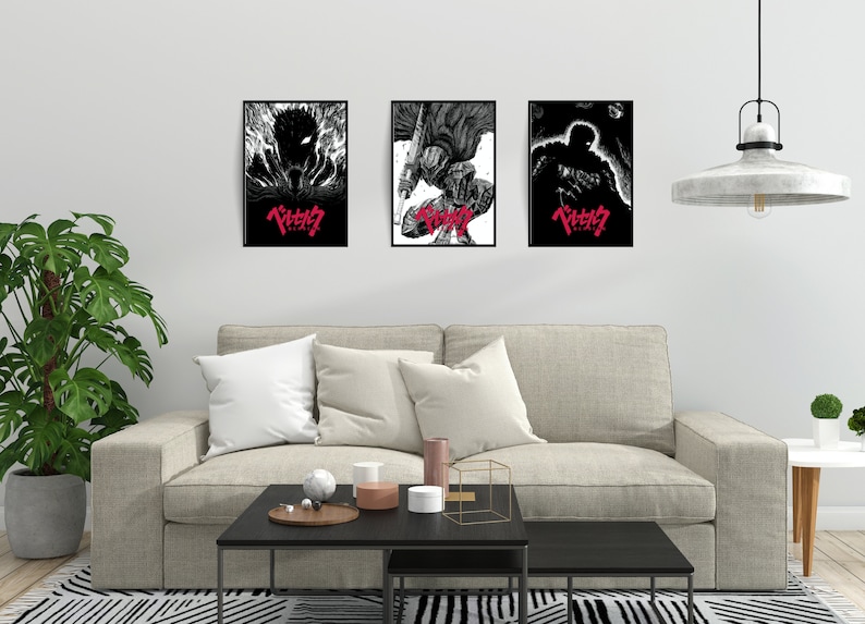 May include: Three black framed posters with black and white illustrations of a character from the anime series "Berserk". The posters have the Japanese title "Berserk" in red lettering.