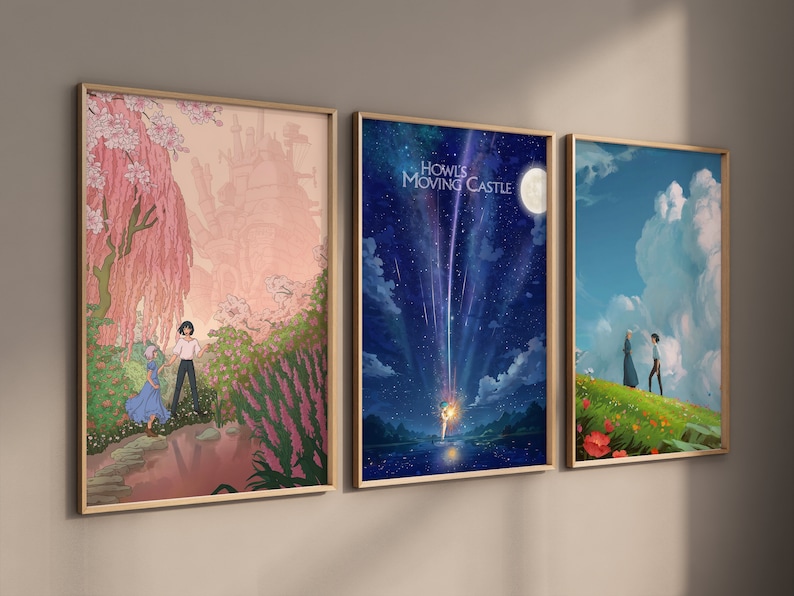 May include: Three framed prints of scenes from the animated film Howl's Moving Castle. The first print shows a pink and white tree with a couple standing in front of it. The second print shows a blue sky with a shooting star and the text "Howl's Moving Castle". The third print shows a couple standing on a green hill with a blue sky and white clouds in the background.
