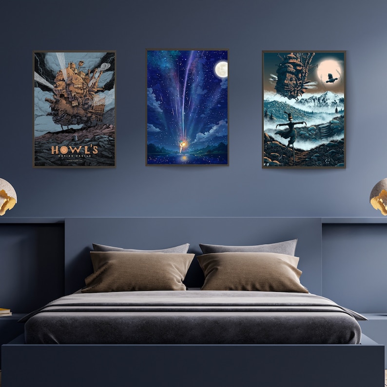May include: Three framed posters featuring scenes from the animated film Howl's Moving Castle. The first poster shows the moving castle against a blue sky with the title "Howl's Moving Castle" in gold lettering. The second poster shows a young woman standing in a field with a shooting star in the sky. The third poster shows the moving castle in the distance with a young woman standing in the foreground.