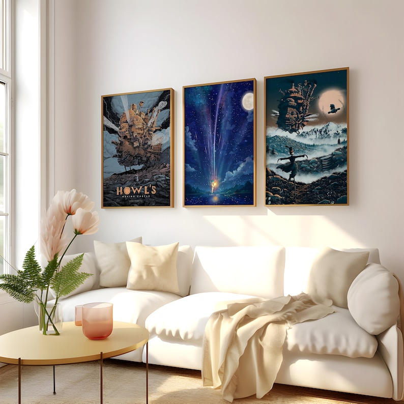 May include: Three framed art prints featuring scenes from the animated film Howl's Moving Castle. The first print shows the castle in the sky, the second print shows a shooting star, and the third print shows a figure in a field with the castle in the background.