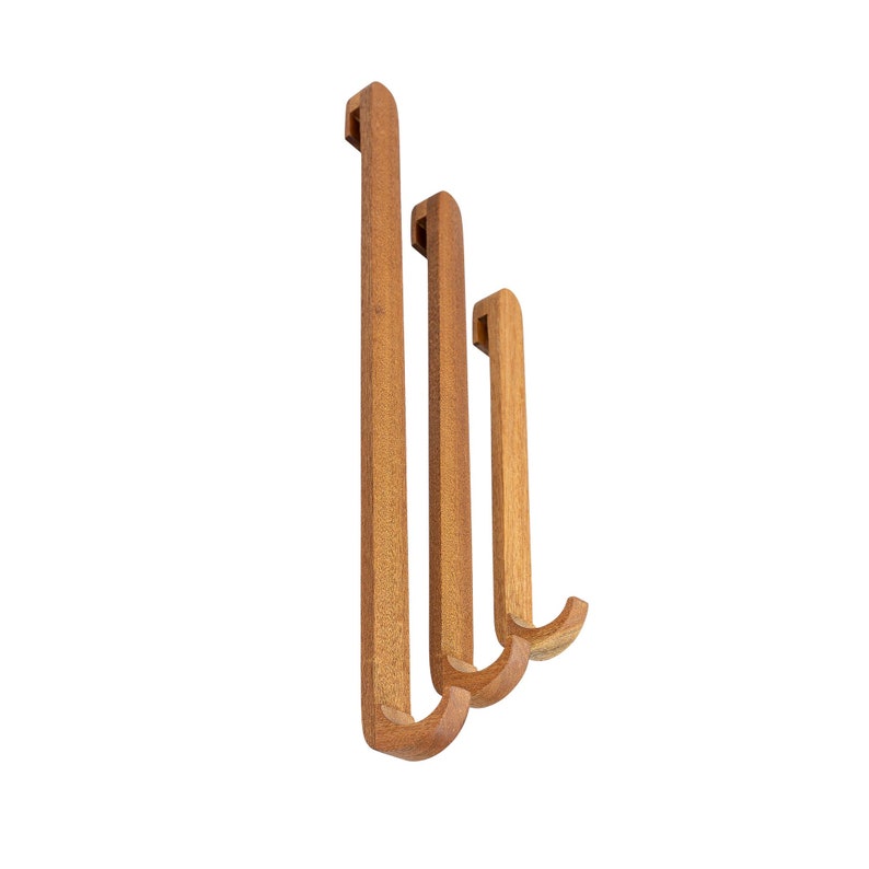 A set of three wooden shower hooks. Enjoy comfort with wooden hooks made especially for small shower cabins. Simply hang it on the shower cabin glass wall.