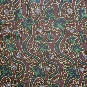 May include: A dark brown fabric featuring a repeating pattern of stylized green fan-shaped leaves and clusters of white dots. The design is outlined with thin yellow dotted lines that create flowing, interconnected curves across the entire surface.