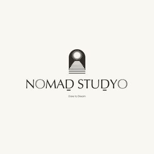 May include: A minimalist logo design featuring the text "NOMAD STUDYO" in a serif font, with a stylized sun and staircase icon above. The tagline "Dare to Dream" is below the text, all in black against a cream background.