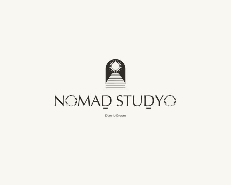 May include: A minimalist logo design featuring the text "NOMAD STUDYO" in a serif font, with a stylized sun and staircase icon above. The tagline "Dare to Dream" is below the text, all in black against a cream background.