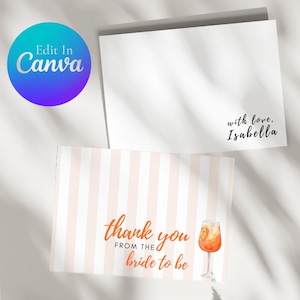 May include: White and peach striped thank you card with the text "thank you from the bride to be" in orange script. A watercolor illustration of a cocktail is on the right. A blank white card is above it, with the text "with love, Isabella".
