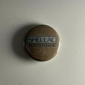 Shellac 1" Button S010B Badge Pin