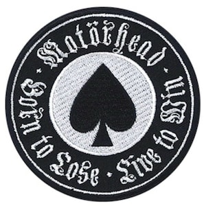 May include: Black and white embroidered patch with the text "Motörhead" in a gothic font. The patch also features a black spade and the text "Born to Lose - Live to Win".