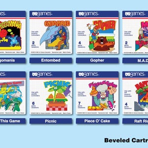 Puede incluir: Una colección de ocho cartuchos de videojuegos vintage con gráficos coloridos y títulos como "Eggomania" y "Entombed". Cada cartucho presenta el logotipo "usgames." y detalles del juego. El texto "Beveled Cartridges" está en la parte inferior.