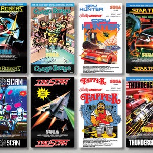 Puede incluir: Colección de cajas de cartuchos de videojuegos SEGA vintage. Los títulos incluyen "Buck Rogers", "Congo Bongo", "Spy Hunter", "Star Trek", "Sub Scan", "Tac Scan", "Tapper" y "Thunderground". Cada caja presenta ilustraciones coloridas y títulos de juegos.