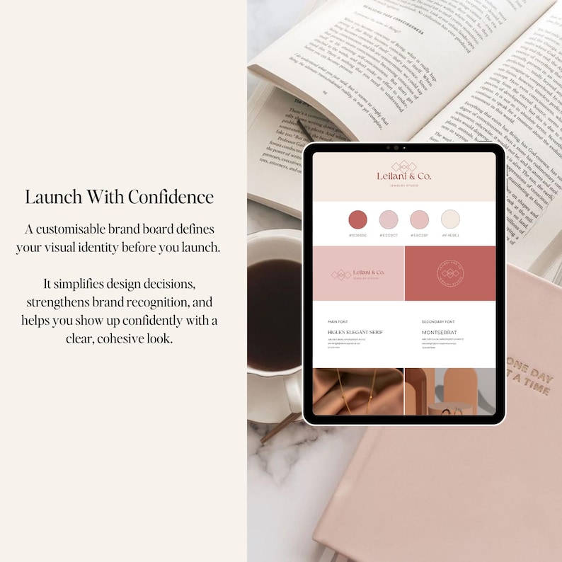 May include: A tablet displays a brand board design with the text "Lelland & Co." and color swatches in shades of red and pink. The tablet is surrounded by an open book, a cup of coffee, and a notebook with the text "ONE DAY AT A TIME."