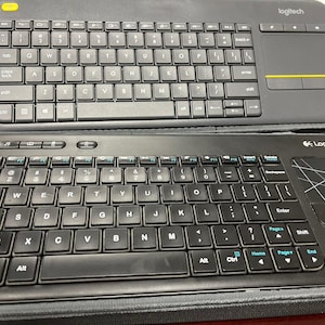 Logitech K400 And A Logitech K400r  and Keyboard Shield