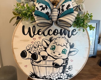 Welcome black and white Highland cow in a barrel wooden round sign