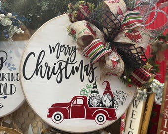 Merry Christmas gnomes riding in red truck