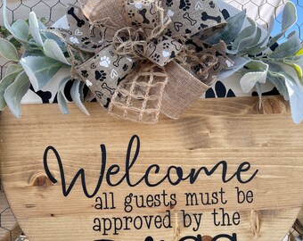 Welcome all guess must be approved by the dogs wooden sign