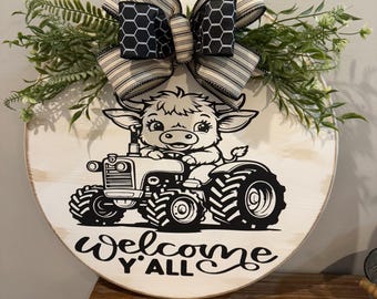 Welcome y’all cow riding a tractor
