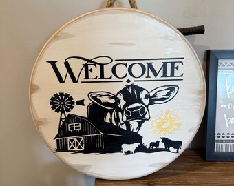 Welcome with cow and barn wooden round sign