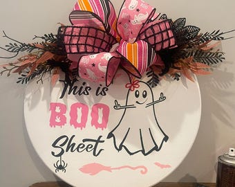This is boo sheets with the ghost  wooden round sign