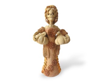 Catrina de barro, figuras de Catrina, Catrina mexicana, mulher esqueleto, Catrina com flores, Catrina com abóboras, Catrina feita à mão, mitologia mexicana