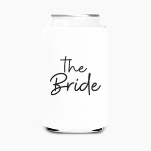 May include: White can cooler with black text that says "the Bride".