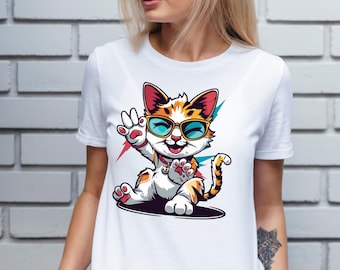 May include: White t-shirt featuring a cartoon cat wearing sunglasses and waving. The cat has orange, white, and brown fur. The shirt has the word "CALYSSA" printed on it.