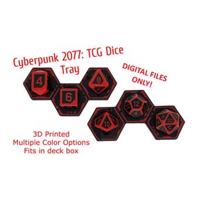 May include: Two black and red hexagonal dice trays with text reading Cyberpunk 2077: TCG Dice Tray, DIGITAL FILES ONLY!, 3D Printed, Multiple Color Options, Fits in deck box. The trays hold various polyhedral dice with red numbers on black surfaces.