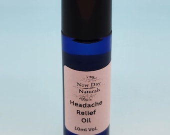 May include: A blue glass roller bottle with a black cap. The label reads "New Day Naturals Headache Relief Oil 10ml Vol."