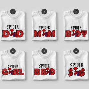 May include: White t-shirts with a Spider-Man theme. Each shirt features the word "SPIDER" above a word in red with a spiderweb design and a Spider-Man graphic. The words are "DAD", "MOM", "BOY", "GIRL", "BRO", and "SIS".