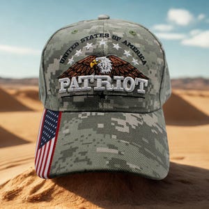 May include: A camouflage baseball cap with the text "PATRIOT" and an eagle design. The cap features the American flag on the side and the words "UNITED STATES OF AMERICA" above the eagle.