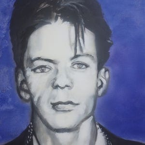 May include: A grayscale portrait painting of a young man with dark hair and light eyes. The painting has a blue background and the subject is wearing a dark suit jacket over a white shirt. The artist's signature is in the bottom right corner.