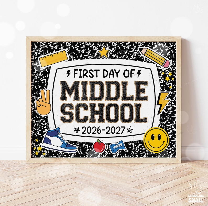 May include: A rectangular sign in a wooden frame featuring a black and white composition notebook pattern background. The center text reads FIRST DAY OF MIDDLE SCHOOL 2026-2027, surrounded by icons of a ruler, pencil, sneaker, apple, and smiley face.