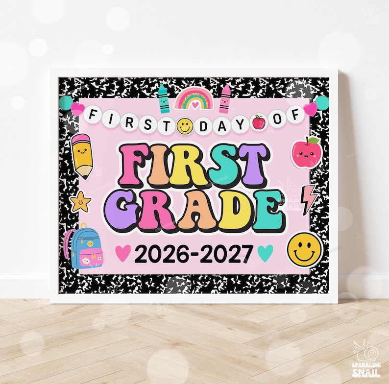 May include: A rectangular sign with a black and white composition notebook pattern border. The center is light pink with the text FIRST DAY OF FIRST GRADE 2026-2027. It features colorful illustrations of a rainbow, pencil, apple, backpack, and smiley faces.