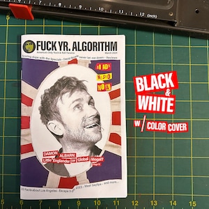 May include: A black and white magazine cover with a color cover featuring a photo of Damon Albarn, the lead singer of Blur and Gorillaz. The magazine is titled "FUCK YR. ALGORITHM" and the subtitle is "America's Only Rock & Roll Fanazine". The cover also includes the text "NO ADS, NO SEO, NO AI" and "BLACK & WHITE W/ COLOR COVER".