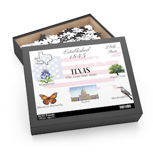 May include: A 120-piece jigsaw puzzle featuring a colorful illustration of Texas state symbols. The puzzle box shows a map of Texas, a bluebonnet flower, a monarch butterfly, the Texas State Capitol building, a pecan tree, and a mockingbird. The box also includes the text "Established 1845", "Texas, The Lone Star State", and "28th State".