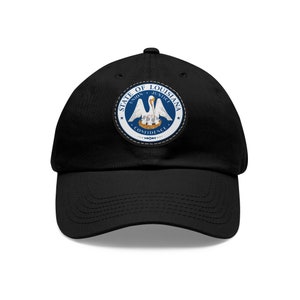 May include: A black baseball cap with a state of Louisiana seal patch. The seal features a pelican with its young in a nest, surrounded by the words "State of Louisiana", "Union", "Justice", and "Confidence".