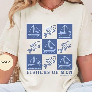 Checkerboard with fish and sail boats with the words Fishers Of Men underneath and Matthew 4:19 at the bottom.