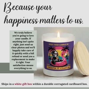May include: A lit white candle with a wooden lid. The candle has a label with the text "DEAD TIRED CANDLE CO" and a graphic of a grim reaper on a flamingo float. The text "CREEPIN IT COASTAL" is also on the label.