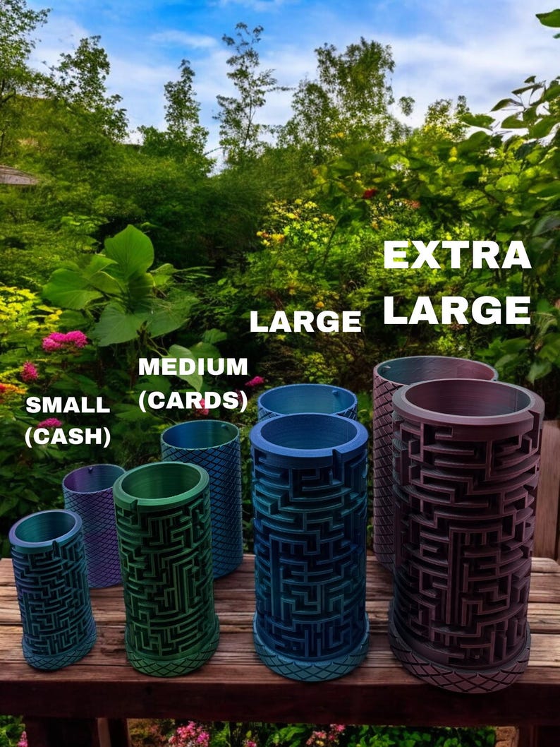 May include: A collection of six cylindrical containers with intricate maze patterns on the exterior, labeled by size as SMALL (CASH), MEDIUM (CARDS), LARGE, and EXTRA LARGE. The containers feature a gradient color finish and a textured base.