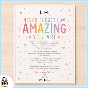 May include: A rectangular white card featuring the name Lucas at the top, followed by the text NEVER FORGET HOW AMAZING YOU ARE in colorful letters. The card includes a heartfelt message about the school year, decorated with small hearts and confetti.