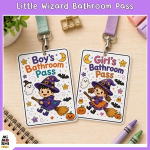 May include: Two rectangular bathroom passes with lanyards. One reads Boy's Bathroom Pass, the other Girl's Bathroom Pass. Both feature illustrations of a child in a wizard hat riding a broomstick, surrounded by ghosts, bats, stars, and pumpkins.