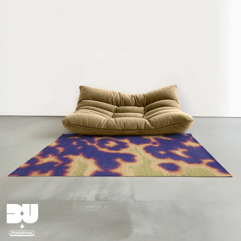 Modern khaki beige togo sofa on Mid century modern style decorative abstract aura and psychedelic area rug, with vivid blueish purple, light yellow and grass green hues animal prints, hand painted faux tufted cowhide pattern in minimalist, Scandinavian living room.