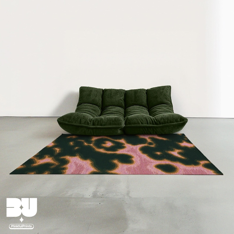 Modern dark forest green togo sofa on Mid century modern style decorative abstract area rug, with dark green, pink and yellow hues animal prints faux tufted pattern in minimalist, Scandinavian living room.