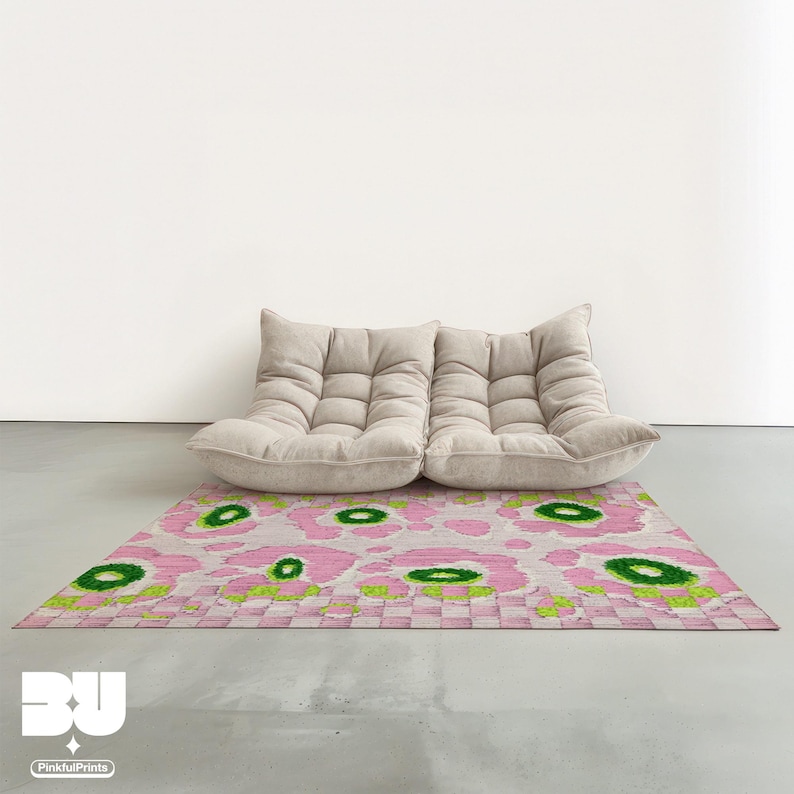 Modern beige modular togo sofa on decorative rug, pastel floral, pink flower carpet, abstract leopard pattern and green checkers patterned rug in minimalist living room.