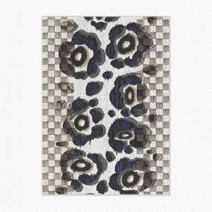 Close up product photo of other color choice of the area rug. Abstract leopard pattern with camel, off white and beige checkered and dark grey floral flower shapes and hand-painted tufted textured indoor and outdoor area rug.