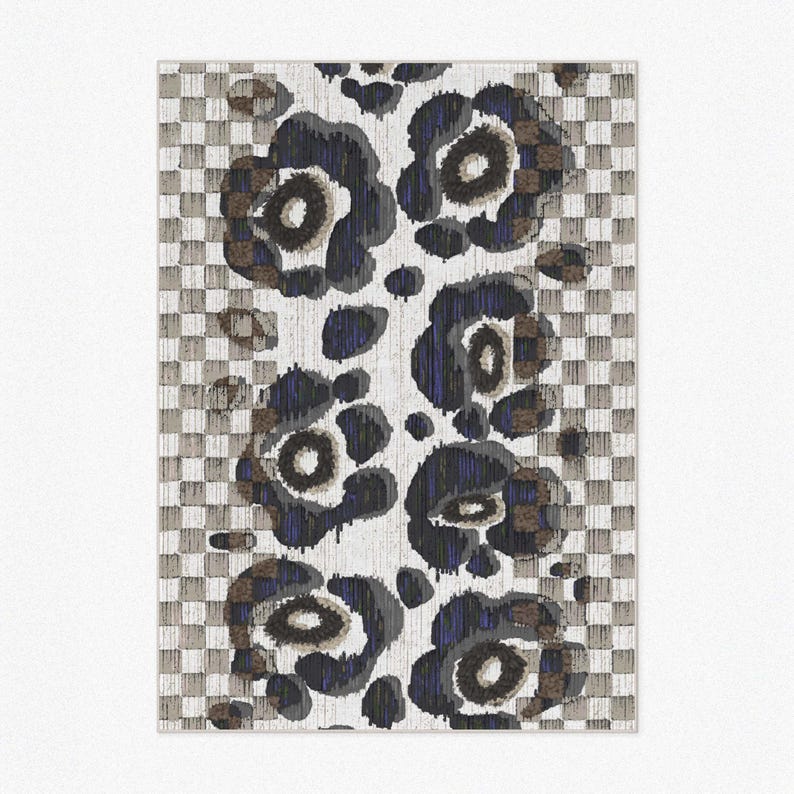 Close up product photo of other color choice of the area rug. Abstract leopard pattern with camel, off white and beige checkered and dark grey floral flower shapes and hand-painted tufted textured indoor and outdoor area rug.