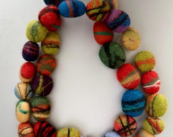 Bead necklace made of pebbles, felted from wool