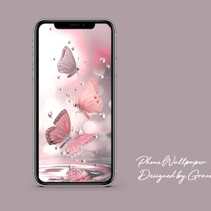 May include: A phone wallpaper featuring three butterflies with pink and white wings. The butterflies are flying over a body of water with water droplets in the air. The background is a soft pink and white gradient.