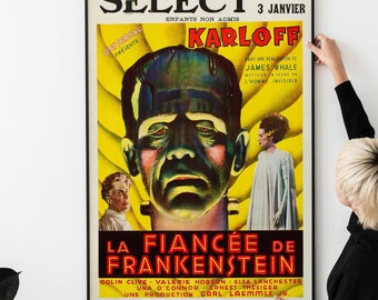 May include: A vintage movie poster for the film "Bride of Frankenstein" featuring a close-up of Boris Karloff as the monster. The poster is yellow, red, and black with the title "La Fiancée de Frankenstein" in red and white. The text "Select" and "Enfants Non Admis" is at the top of the poster.