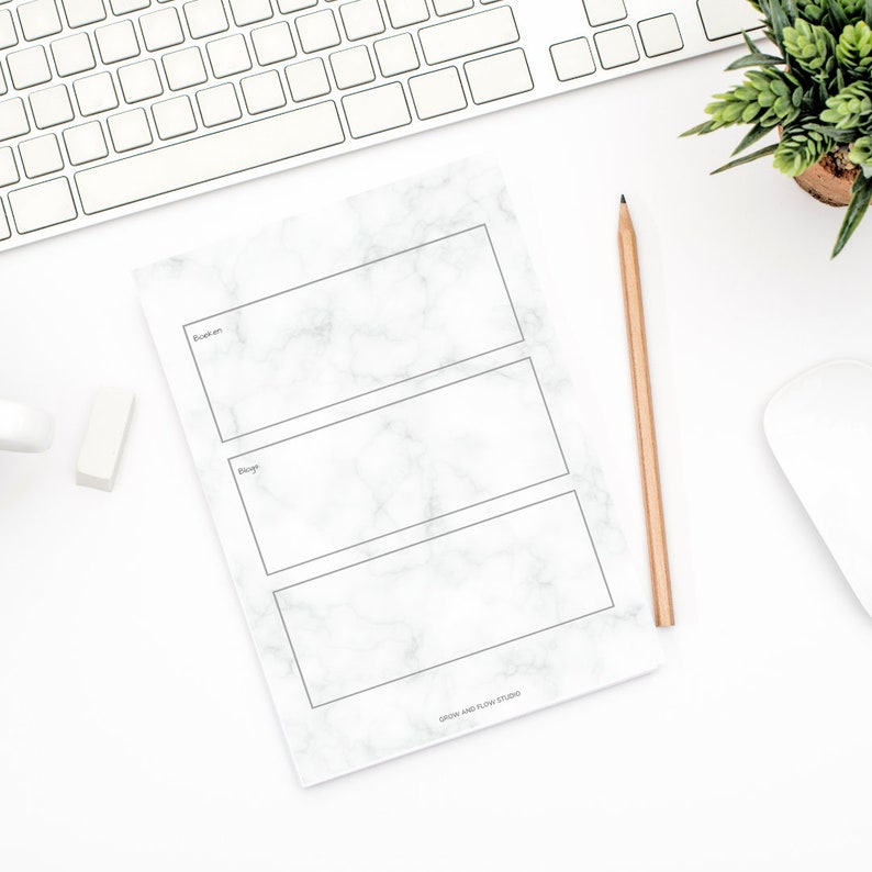 May include: A white marble notepad with three blank sections for writing. The sections are labelled "To-do", "Doing", and "Done". The notepad has a black border and the text "GROW AND FLOW STUDIO" at the bottom.