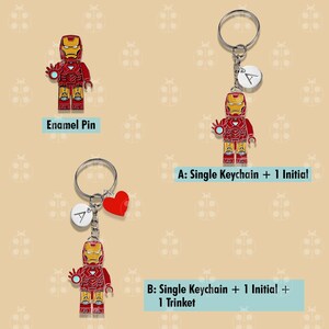 Puede incluir: Alfileres y llaveros de esmalte con una figura de Iron Man roja, amarilla y dorada. Los llaveros incluyen un dije de inicial y un dije de coraz&oacute;n rojo. El texto en la imagen dice "Enamel Pin", "A: Single Keychain + 1 Initial" y "B: Single Keychain + 1 Initial + 1 Trinket."